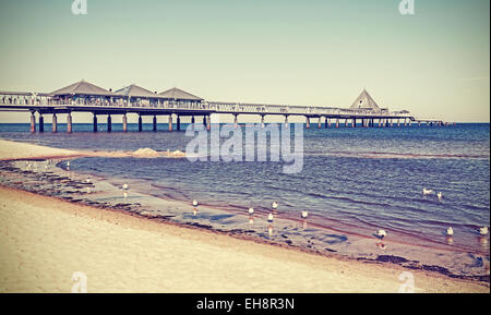 Retro filtered pier in Heringsdorf, Baltic Sea, Germany. Stock Photo