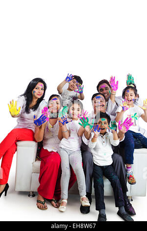 indian group crowds grand Parents Joint Family holi Festival sitting Sofa hand showing Stock Photo