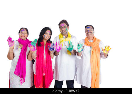 4 indian Adults Parents son and Daughter-In-Law holi Festival hand showing Stock Photo
