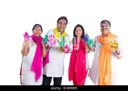 4 indian Adults Parents son and Daughter-In-Law holi Festival hand showing Stock Photo