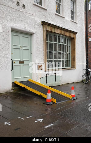 wheelchair ramp into shop Stock Photo - Alamy