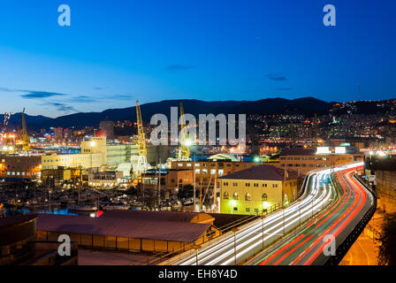 A traffic congested street across the harbor of Genoa Stock Photo