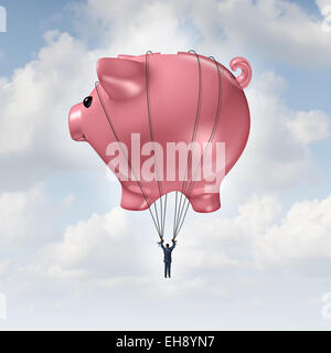 Financial freedom concept as a piggy bank hot air balloon lifting a businessman up to success as a wealth management and investment advice metaphor. Stock Photo