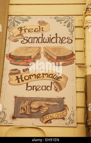 hand painted sign advertising sandwiches, Half Moon Bay, California Stock Photo