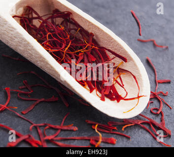 stigmas of saffron in wooden spoon Stock Photo