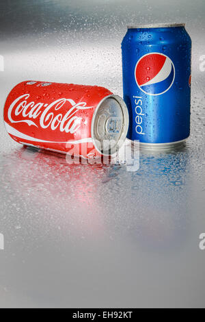 SABAH, MALAYSIA - March 08, 2015: Coca-Cola and Pepsi cans on metal background. Stock Photo