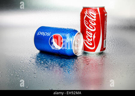 SABAH, MALAYSIA - March 08, 2015: Coca-Cola and Pepsi cans on metal background. Stock Photo