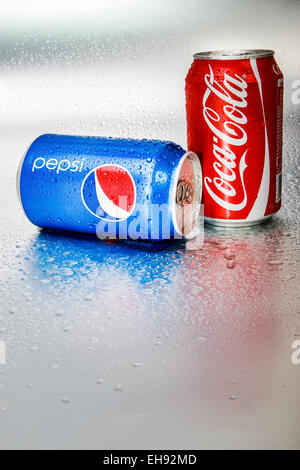 SABAH, MALAYSIA - March 08, 2015: Coca-Cola and Pepsi cans on metal background. Stock Photo