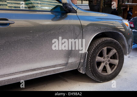 Car covered in dried road salt brine - USA Stock Photo