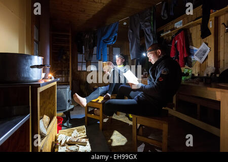 Relaxing at Nallostugan hut, Kiruna, Sweden, Europe, EU Stock Photo