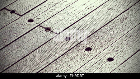 Grungy wood panels, texture or background with shallow depth of field. Stock Photo