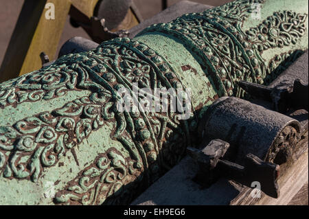 Weathered patina on Light British copper bronze field cannon gun with fine decoration and molding Stock Photo