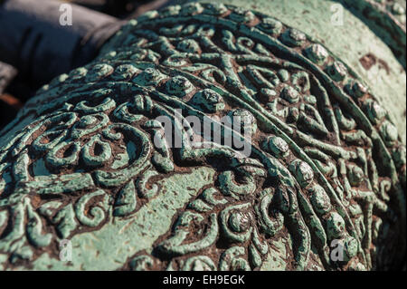 Weathered patina on Light British copper bronze field cannon gun with fine decoration and molding Stock Photo