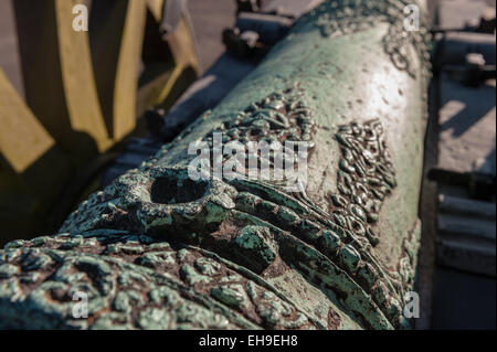 Weathered patina on Light British copper bronze field cannon gun with fine decoration and molding Stock Photo