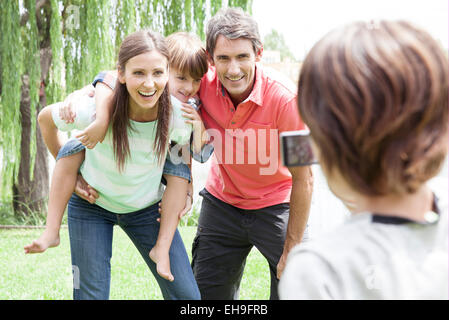 Boy taking snapshot of his family Stock Photo