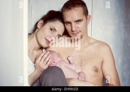 Parents holding newborn baby, portrait Stock Photo