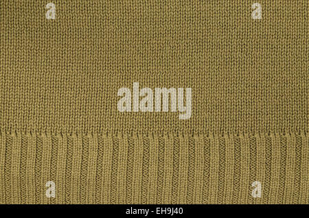close up of a ocher knitted background pattern, knitted right and left, detail, macro, full frame,  blank, empty Stock Photo