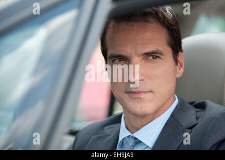 Businessman driving car Stock Photo