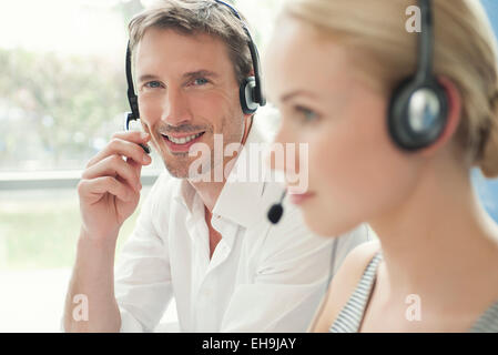 Professionals working in call center Stock Photo