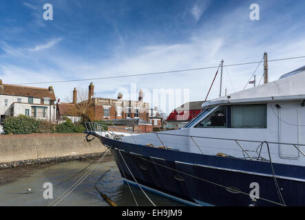 Boats moored on the banks of the River Crouch at Burnham on Crouch in Essex. Stock Photo
