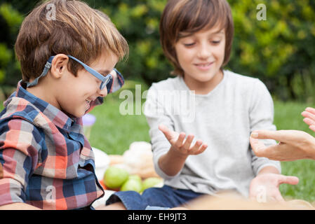 Boys playing clapping game Stock Photo