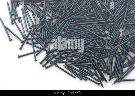 Heap of  Blue Concrete nails texture isolated on white Stock Photo
