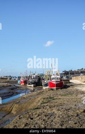 Cockle boats tied up at low tide at Leigh on Sea in Essex. Stock Photo