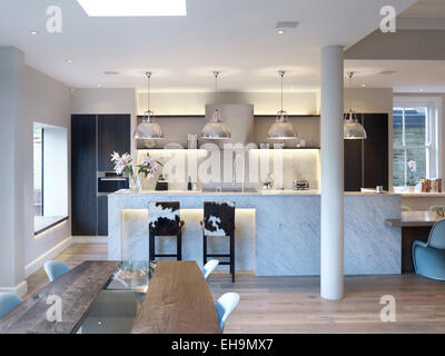 Dining area and kitchen in large open plan room, residential house, Thurleigh Road, Clapham, London, UK Stock Photo