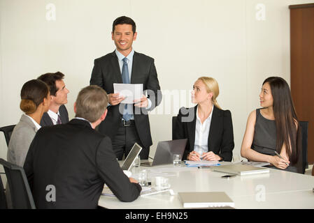 Executive giving presentation in meeting Stock Photo