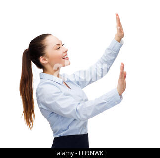 smiling businesswoman pointing to something Stock Photo