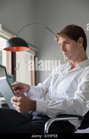 Businessman using digital tablet Stock Photo