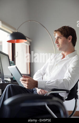 Businessman using digital tablet Stock Photo