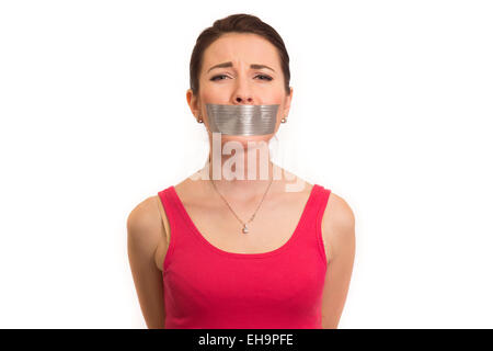 abused woman in red with gaffer tape on her mouth experiencing emotional pain isolated Stock Photo