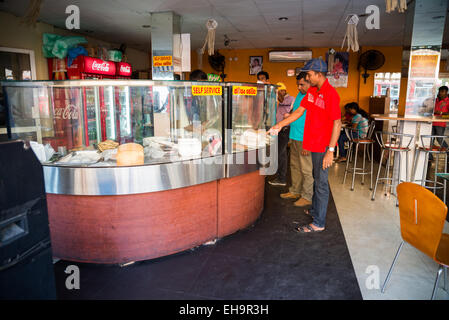 Cook preparing traditional Sri Lankan fast food in Colombo, bus station, Sri Lanka, Asia Stock Photo