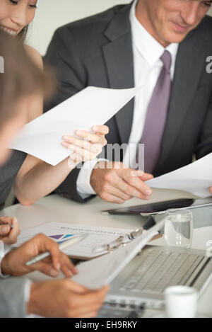Businessman at meeting pleased by good news Stock Photo