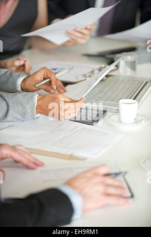 Business associates collaborating in meeting, cropped Stock Photo