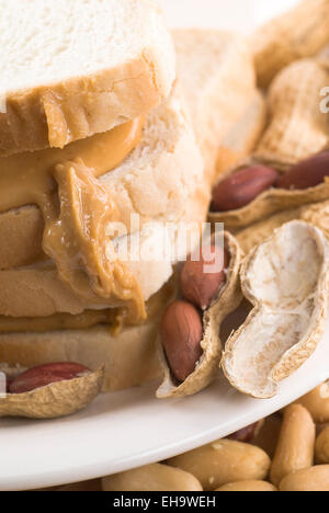 Peanut butter sandwich with peanuts on a plate. Stock Photo
