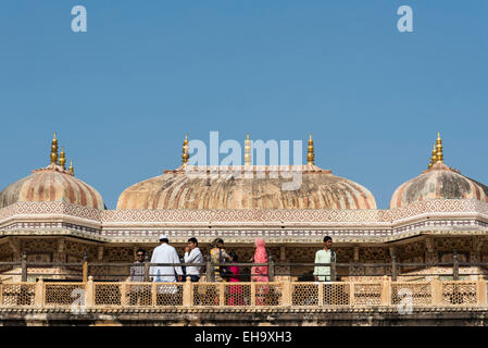 Visitors on Roof of Ganesh Pol (Gate) at Amber Palace (Amer Fort), Jaipur, Rajasthan, India Stock Photo