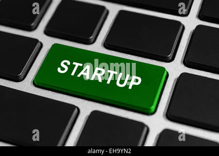 Startup green button on keyboard, business concept Stock Photo