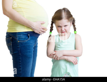jealous kid and her pregnant mother Stock Photo