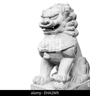 Ancient Chinese lion statue made of gray stone isolated on white background Stock Photo