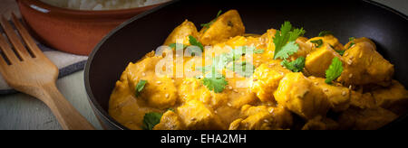 Butter chicken curry with basmati rice and cilantro. Stock Photo