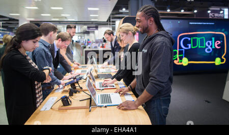 Tuesday, March 10, 2015  Embargoed to 0001 Wednesday March 11 Customers at the new Google store in Currys PC World in London. The Google shop will give customers the chance to try all of google devices and software Stock Photo