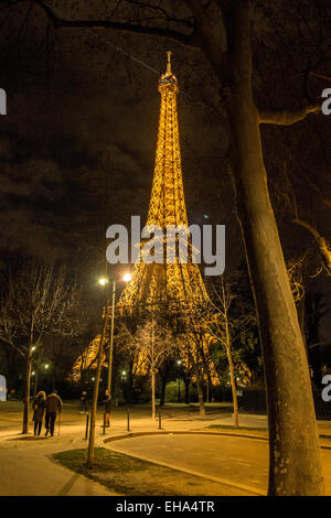The Eiffel Tower in Paris, France. Photo taken in the Champ De Mars, a landscaped area at the foot of the tower. Stock Photo