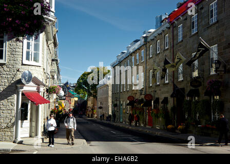 Early morning tourists walking shops and restaurant along Rue Saint-Louis in upper old Quebec City Stock Photo