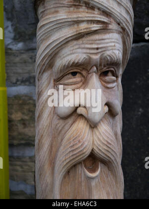 Carvings of wood spirit faces Stock Photo