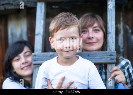 Happy family outdoor, a little boy in the foreground. Stock Photo