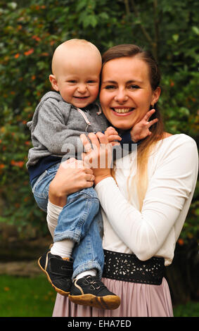 Portrait of happy woman with toddler in home Stock Photo - Alamy