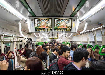 Seoul, South Korea - October 24, 2014: A crowded train carriage at rush hour in the Seoul subway, Korea Stock Photo