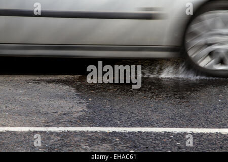 Scottish Drivers struggling to cope with pothole problems along Dens Road in Dundee, UK Stock Photo